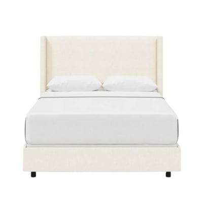 An elegant upholstered bed with a white headboard.