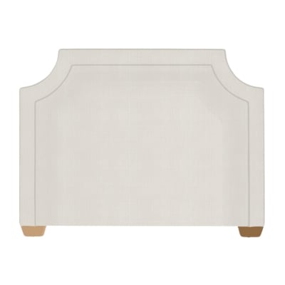 An upholstered bed with a beige headboard.