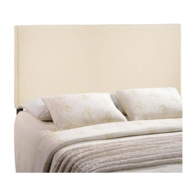 An upholstered bed with a beige headboard.