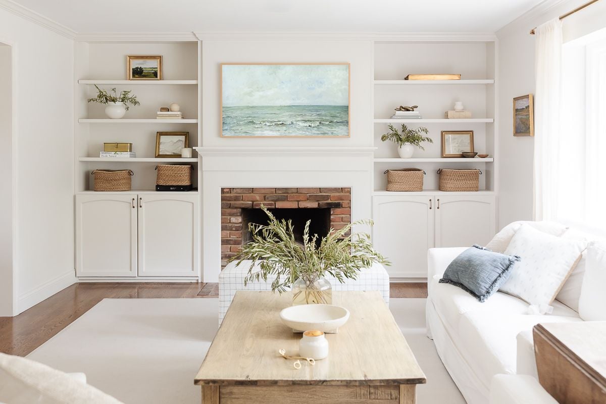 A wooden coffee table in a white living room