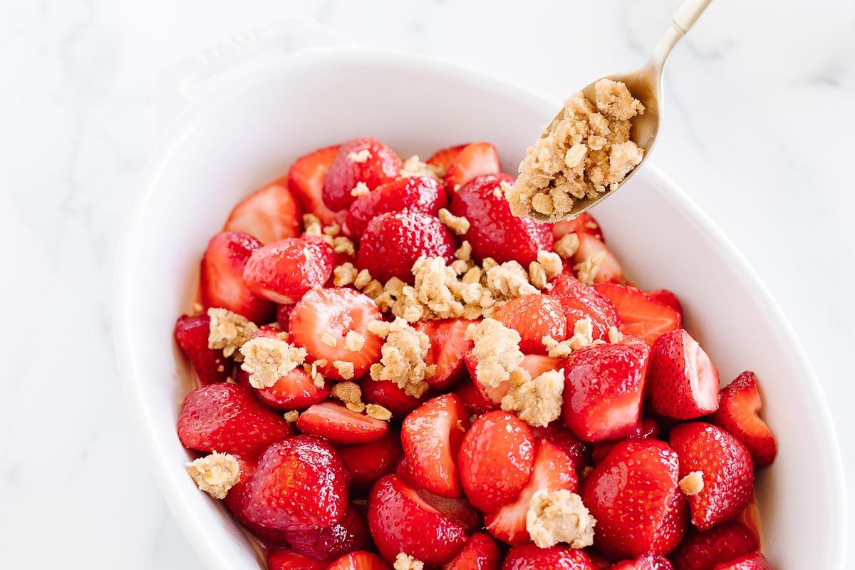 Strawberry crumble in a white baking dish