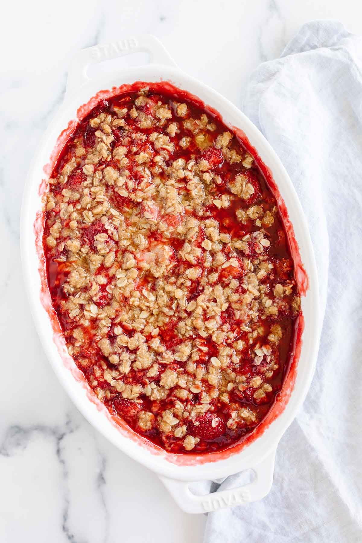 A strawberry crumble, topping with a crumble topping with oats.