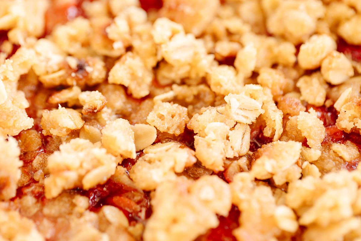 A strawberry crumble, topping with a crumble topping with oats.