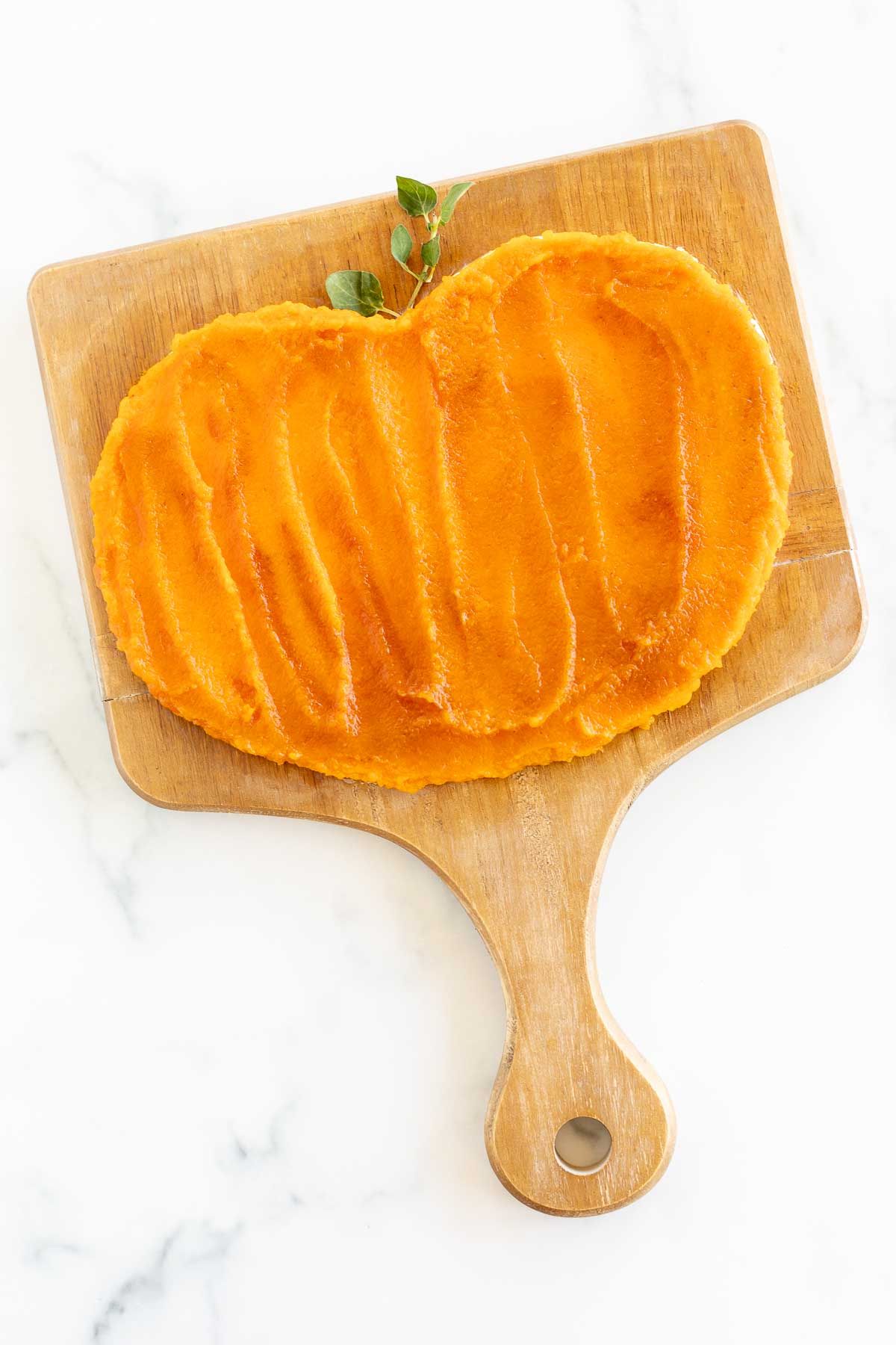 A butter board for fall, topped with pumpkin puree and spices