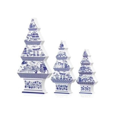 Three blue and white christmas trees decorated with christmas decorations on a white background.