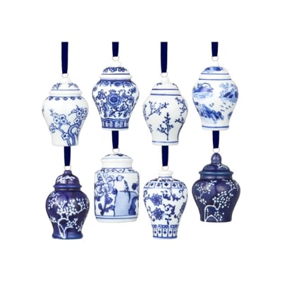 A set of blue and white Christmas decorations hanging on a string.