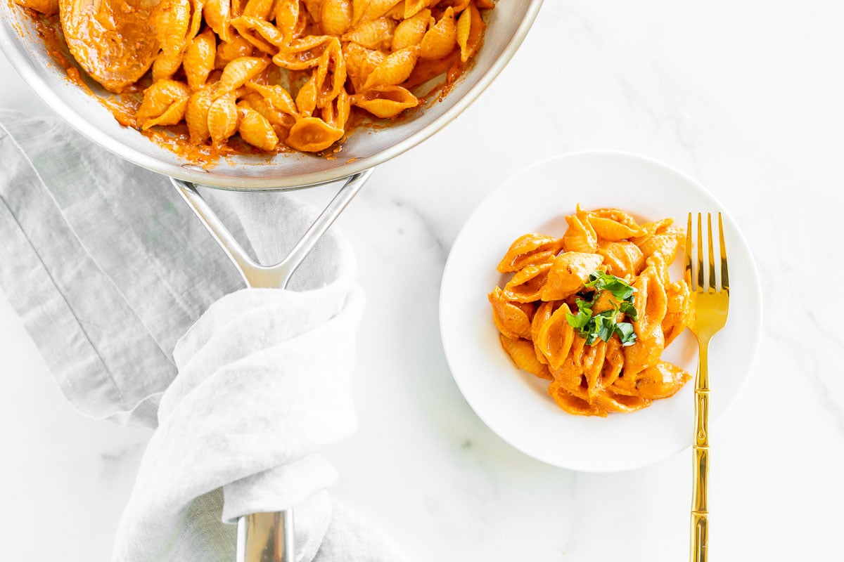 A silver pan full of Gigi Hadid pasta, a spicy vodka shell pasta recipe.