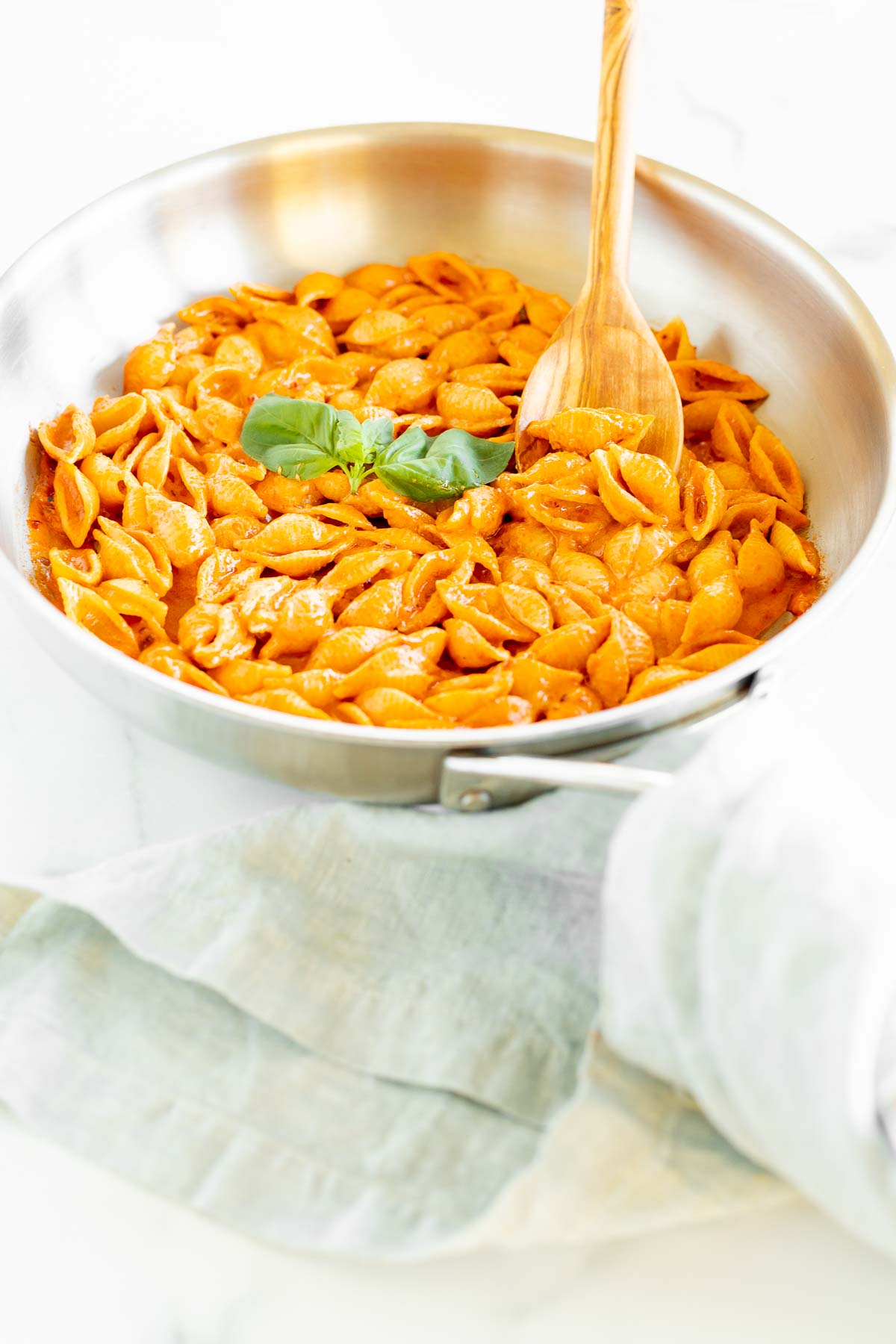 A silver pan full of Gigi Hadid pasta, a spicy vodka shell pasta recipe.
