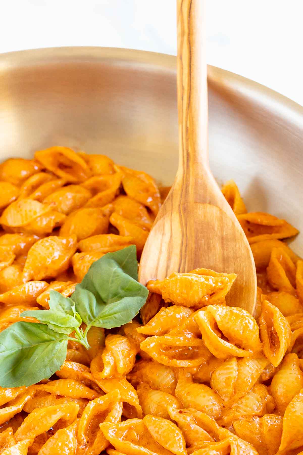 A silver pan full of Gigi Hadid pasta, a spicy vodka shell pasta recipe.