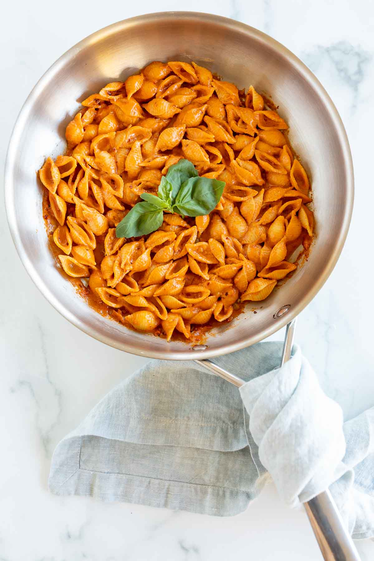 A silver pan full of Gigi Hadid pasta, a spicy vodka shell pasta recipe.