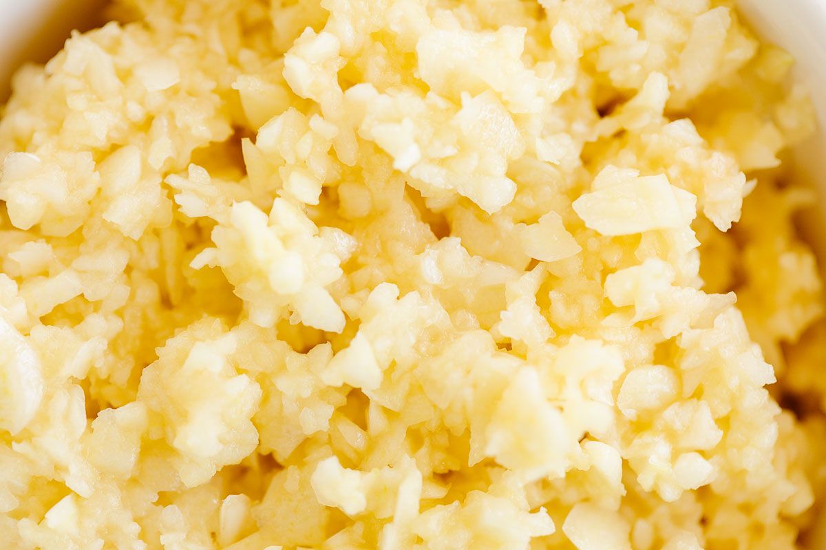 A close up of minced garlic