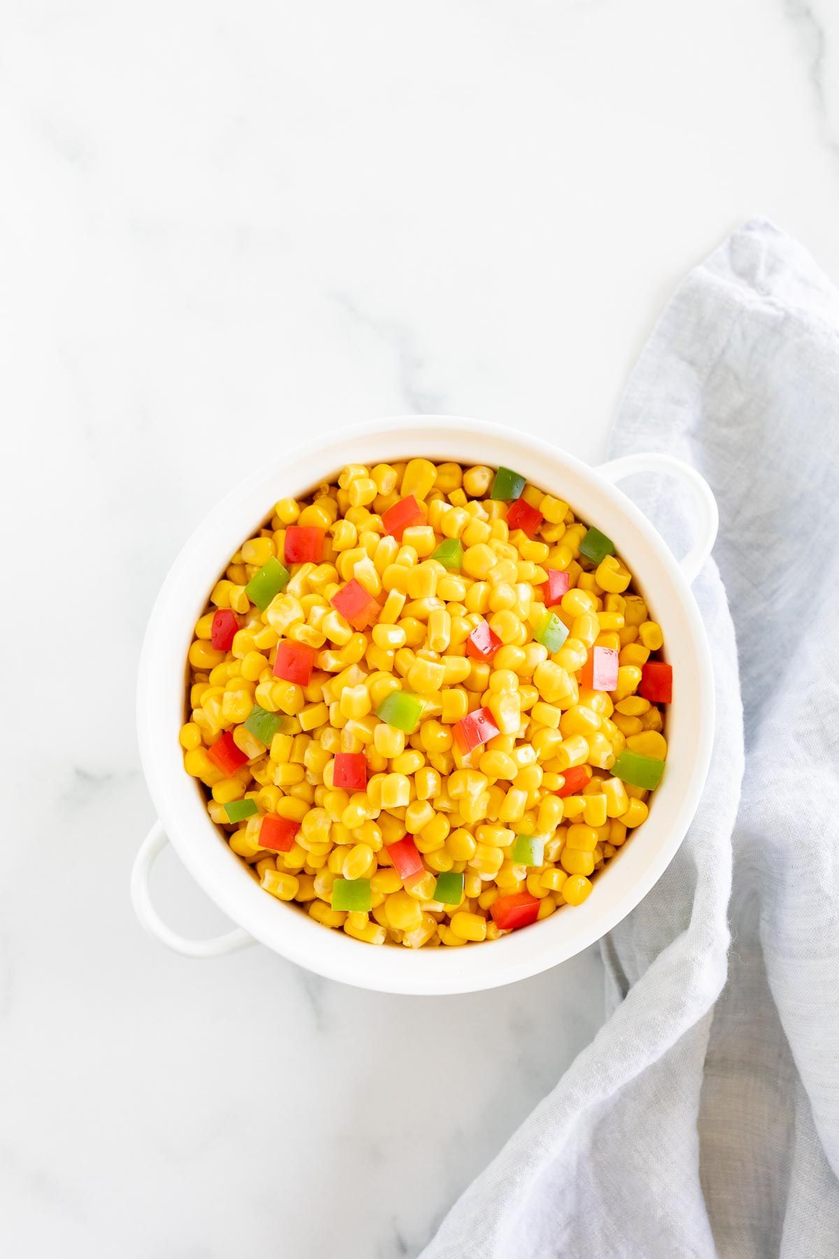 Homemade Mexicorn substitute in a white serving bowl, placed on a white marble countertop.