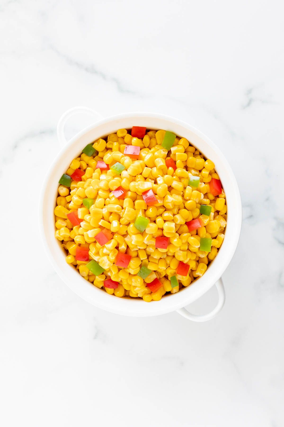 Homemade Mexicorn substitute in a white serving bowl, placed on a white marble countertop.