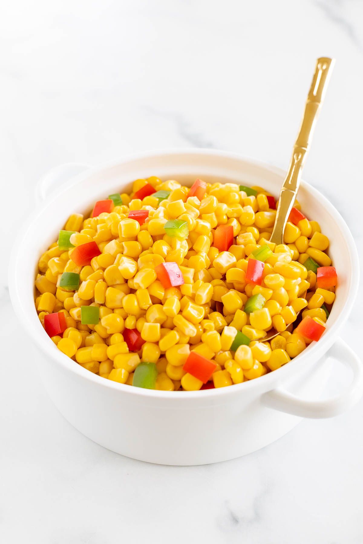 Homemade Mexicorn in a white serving bowl, placed on a white marble countertop.