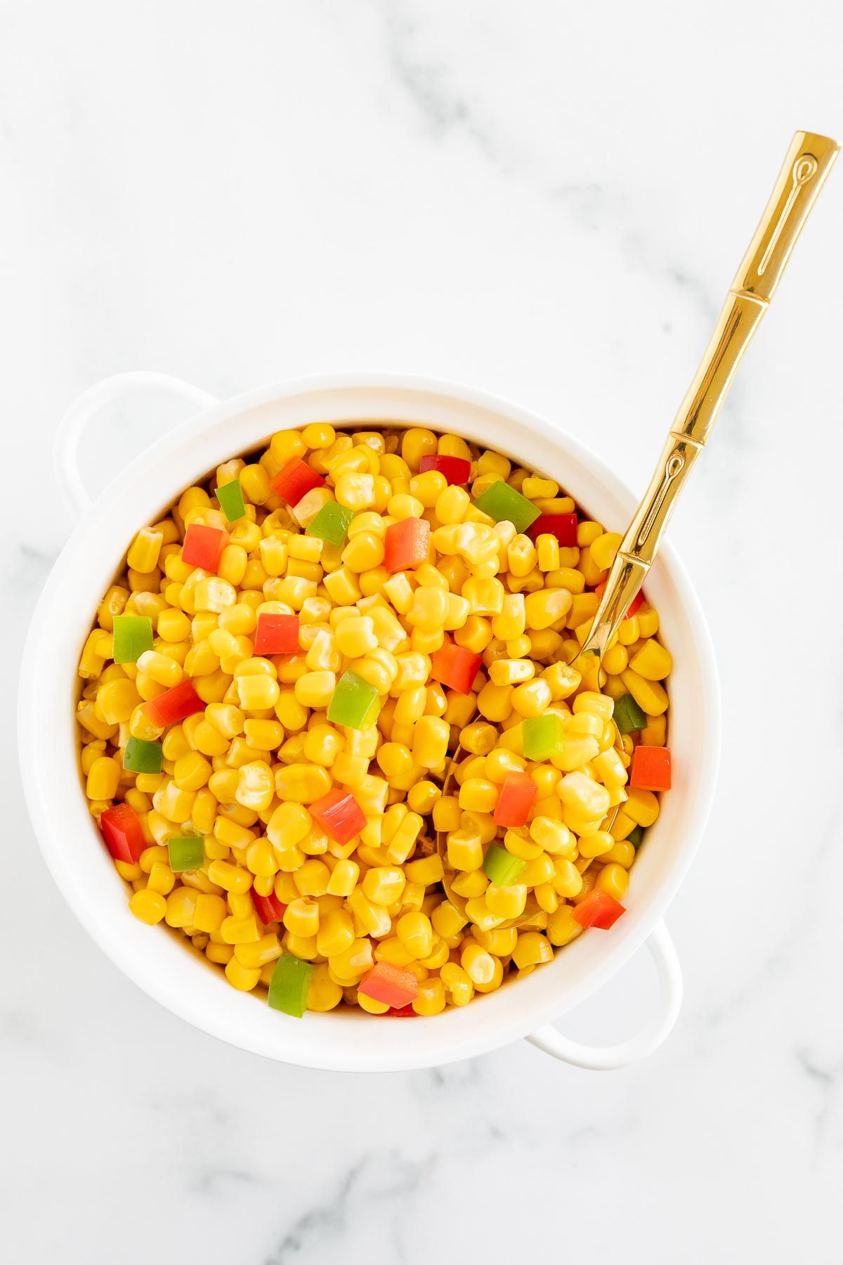 Homemade Mexicorn in a white serving bowl, placed on a white marble countertop.