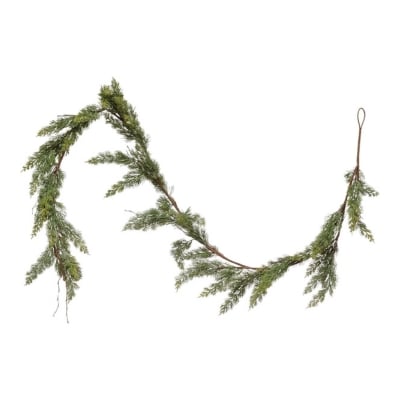 A cedar garland hanging on a white background.