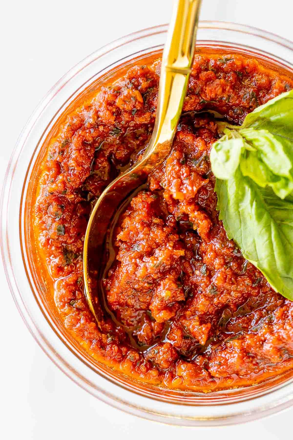 A small bowl of pesto rosso sun dried tomato pesto