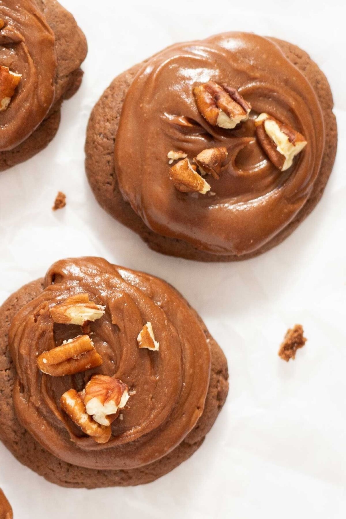 Chocoalte sheetcake cookies topped with buttercream chocolate frosting and pecans. 