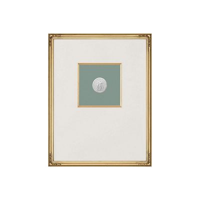 A framed intaglio with a white matting.