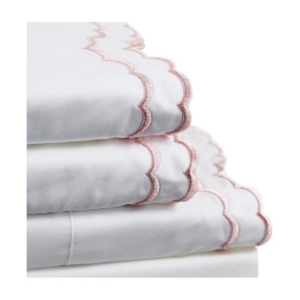 A stack of white sheets with scalloped pink trim.