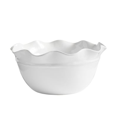 A white bowl with a scalloped rim.