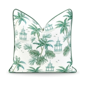 A green and white pillow with palm trees, perfect for adding a tropical touch to your home decor.