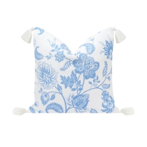 A blue floral pillow with tassels, available on Amazon.