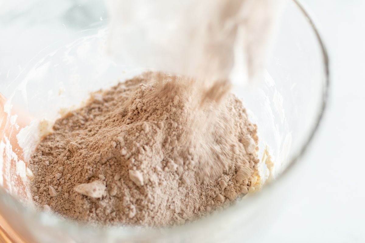 A cake mix in a glass mixing bowl