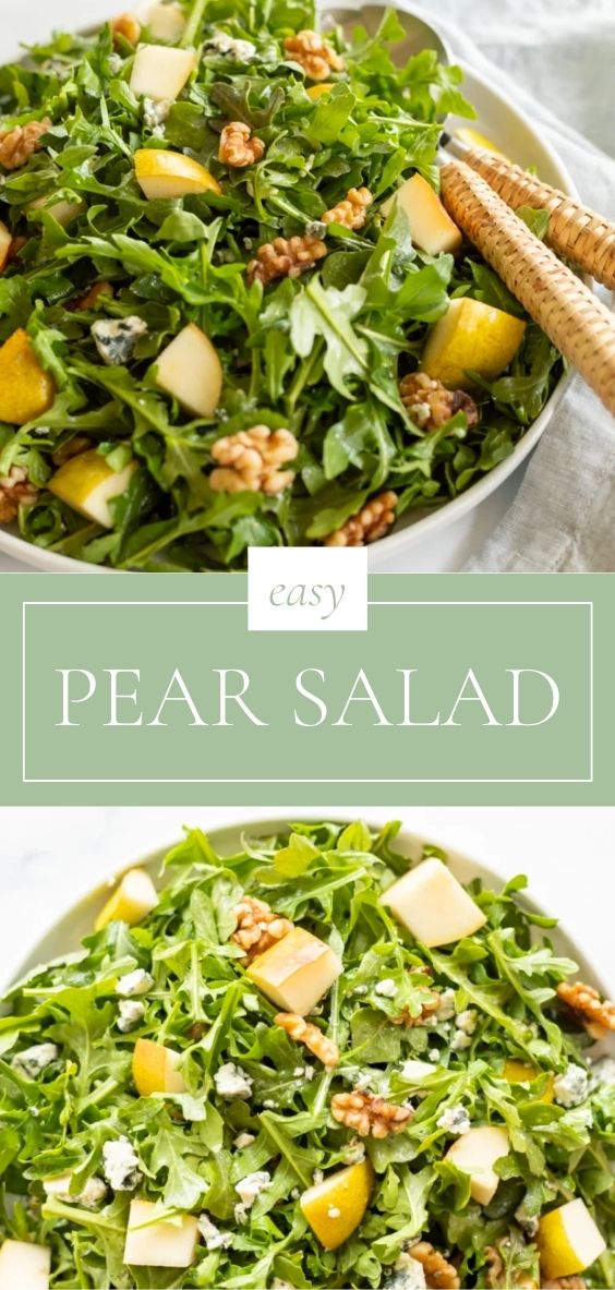 On a marble counter top, there is a round white bowl, there is a pear salad and natural fiber utensils.