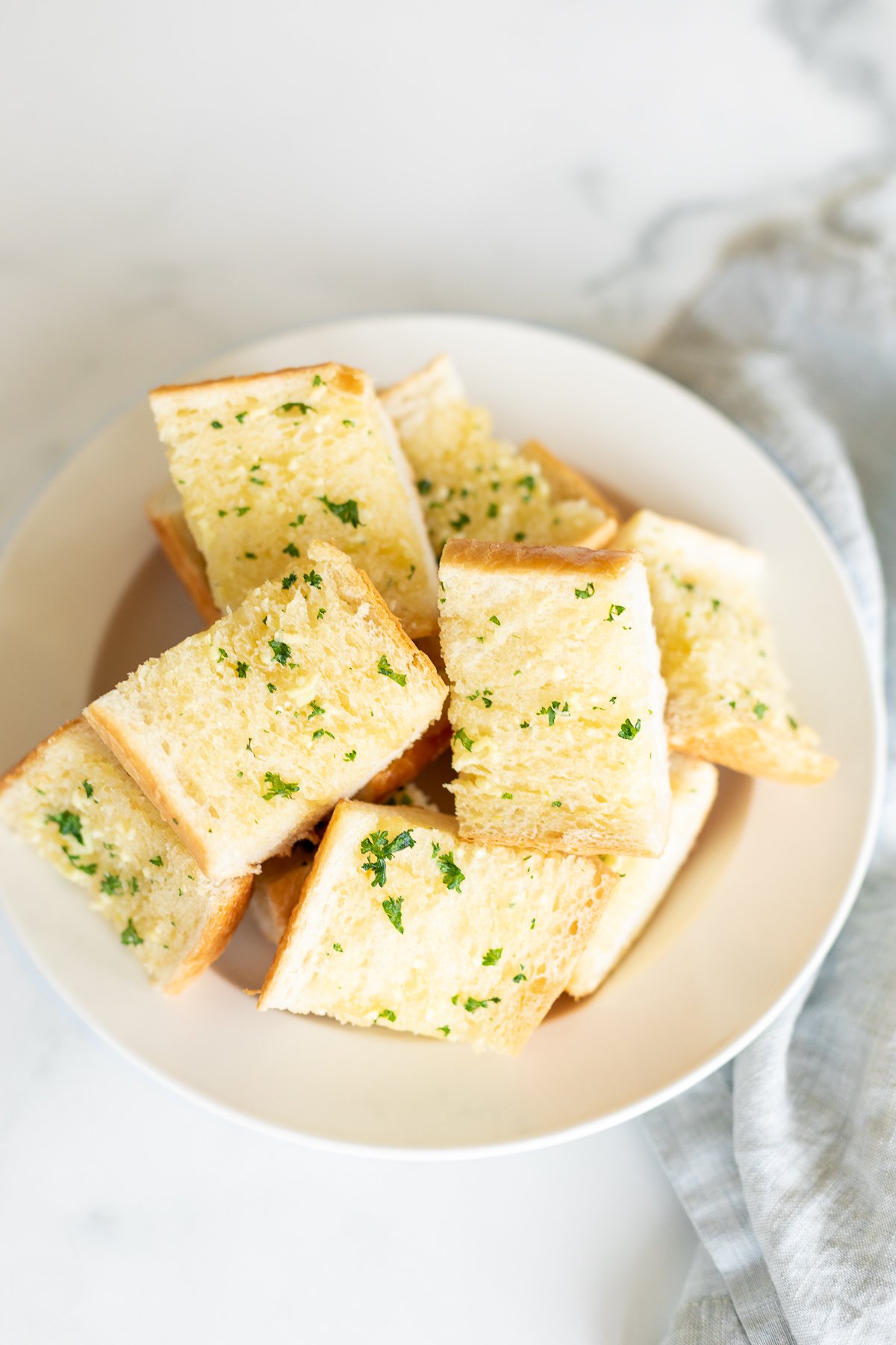 Bowl full of homemade garlic bread slices
