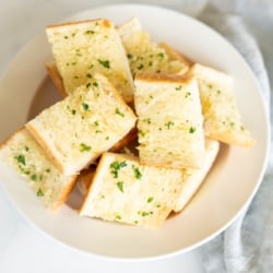 Bowl full of homemade garlic bread slices