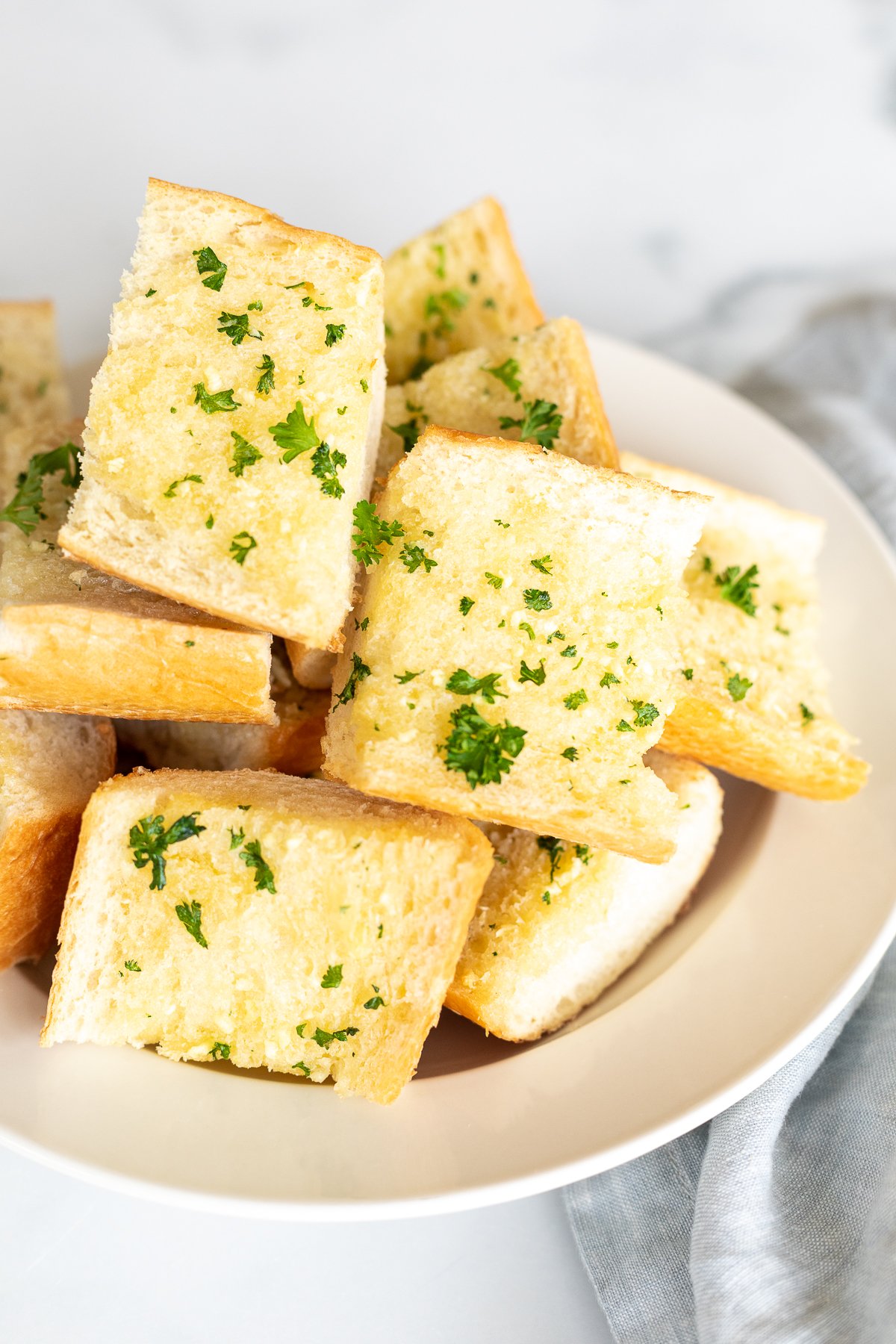Bowl full of homemade garlic bread slices