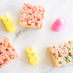 Overhead view of Peeps treats on marble countertop with yellow and pink Peeps