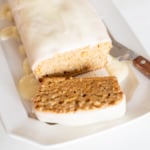 A carrot cake loaf topped with cream cheese glaze