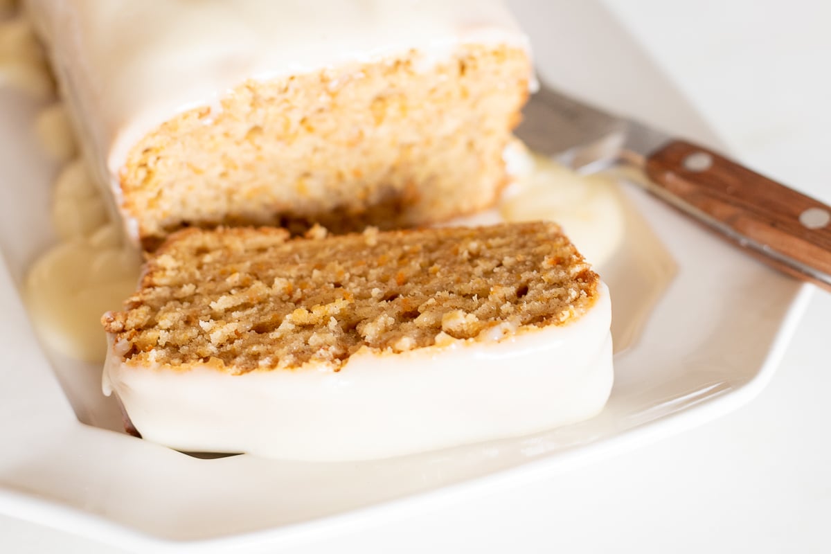 A carrot cake loaf topped with cream cheese glaze