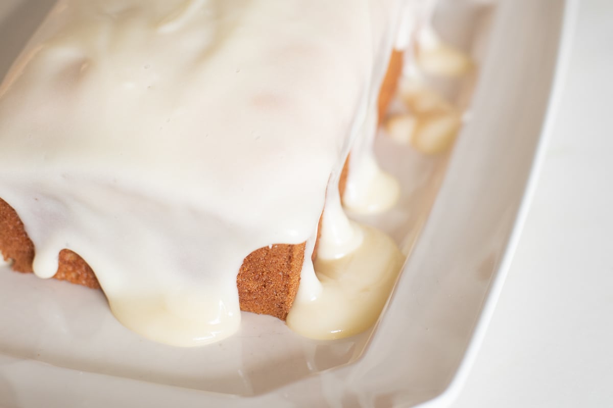 A carrot cake loaf topped with cream cheese glaze