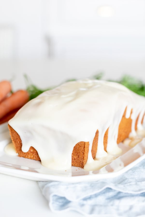 A carrot cake loaf topped with cream cheese glaze