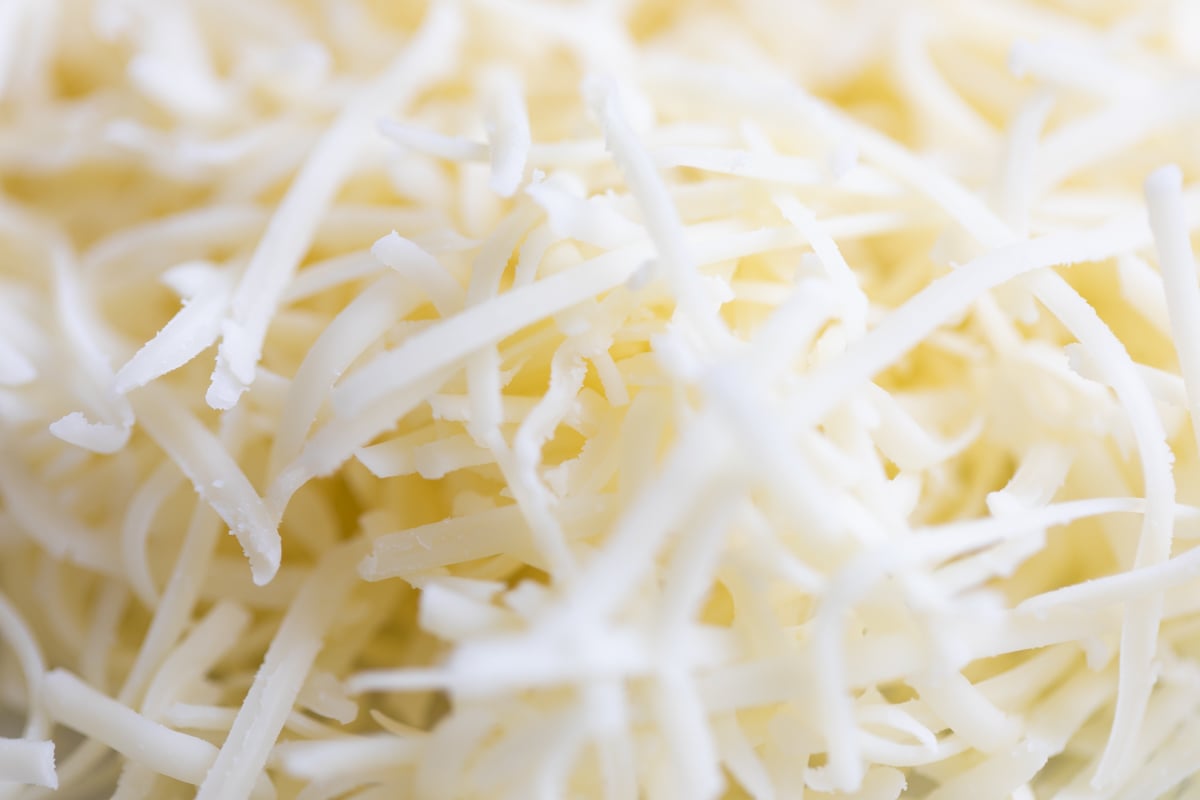 Fresh shredded white cheese.