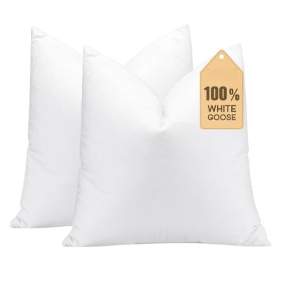 Two white pillows with a tag reading "100% White Goose" make perfect pillow inserts for enhancing comfort and style.