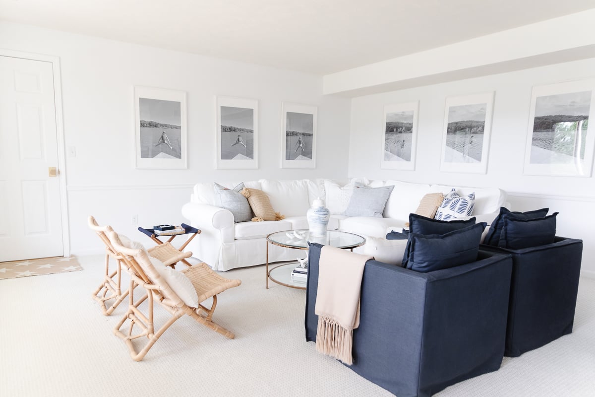 white and blue living room with rattan and brass accents