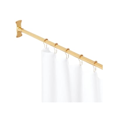 A brass shower curtain rod with a white curtain hanging from it.