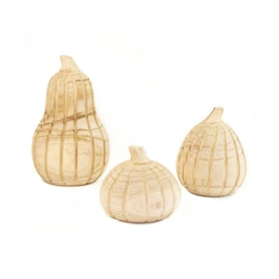 a set of three natural wood pumpkins