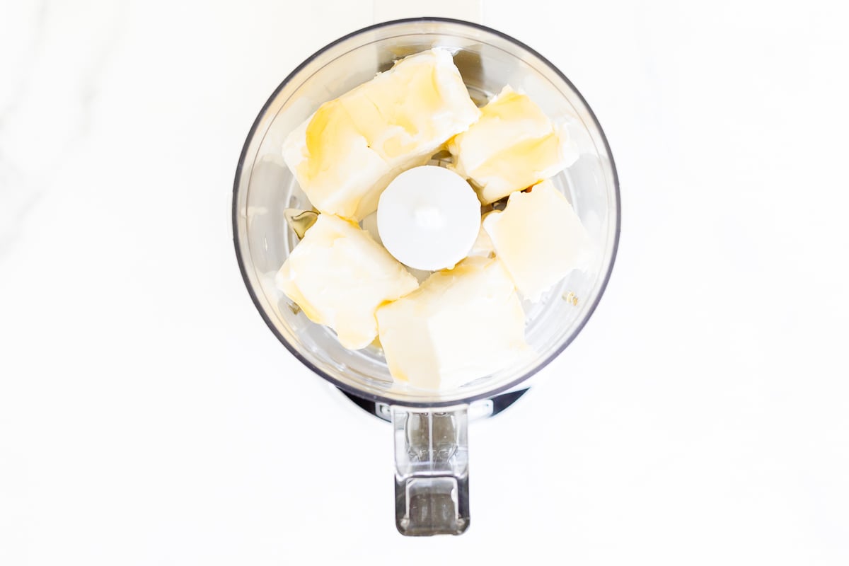 Butter mixed with honey in a food processor.