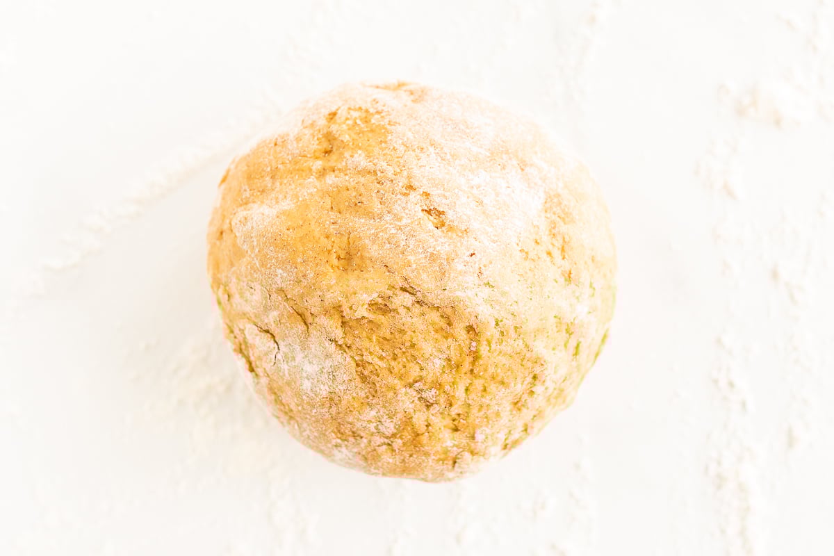 A pumpkin cinnamon roll on a white background.