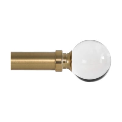 A brass rod with a glass ball on it, adorned with pinch pleat drapes.