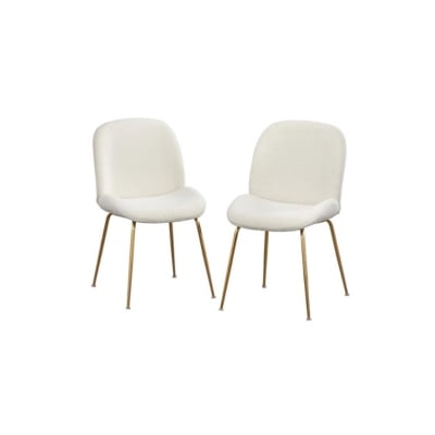 Two white chairs with gold legs, offering a look for less alternative to Arhaus.