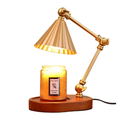 A gold lamp with a candle on it.