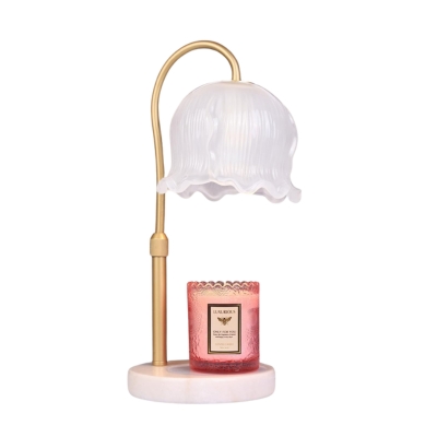 A table lamp with a candle on it.