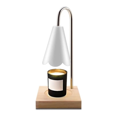 A candle is sitting on top of a wooden base.