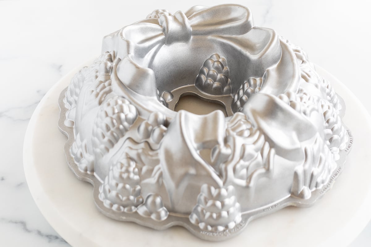 A Christmas Bundt Cake with a silver bow on top.